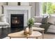 Cozy living room featuring a stylish fireplace, comfortable seating, and a sunny window at 14303 Glenayre Cir, Parker, CO 80134