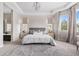 Bright main bedroom featuring a large window and neutral decor at 14303 Glenayre Cir, Parker, CO 80134