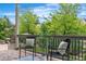 Outdoor patio with comfortable seating and green foliage at 14303 Glenayre Cir, Parker, CO 80134