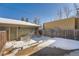 Backyard featuring snow and a garage with a door at 2038 S Columbine St, Denver, CO 80210