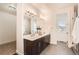Well-lit bathroom with double sinks, sleek fixtures, and modern design at 2038 S Columbine St, Denver, CO 80210