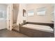 Modern bathroom featuring a soaking tub, glass-enclosed shower, and tiled floors at 2038 S Columbine St, Denver, CO 80210