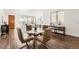 Modern dining room showcases a glass table, stylish chairs, and hardwood floors at 2038 S Columbine St, Denver, CO 80210
