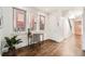 Hallway with hardwood floors and natural light from a window at 2038 S Columbine St, Denver, CO 80210