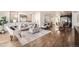 Bright and airy living room with modern decor, hardwood floors, and an open layout connected to the kitchen at 2038 S Columbine St, Denver, CO 80210