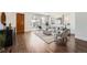 Bright living room features hardwood floors, modern decor, and a sliding glass door to the outdoor space at 2038 S Columbine St, Denver, CO 80210