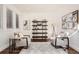 Comfortable living room featuring stylish decor, plush armchairs, and a decorative shelving unit at 2038 S Columbine St, Denver, CO 80210