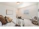Spacious bedroom boasts carpet flooring, with a sitting area and natural light at 2038 S Columbine St, Denver, CO 80210