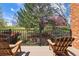 Relax on this private back deck overlooking a lush green lawn, mature trees, and a serene neighborhood at 6213 S Lima Way, Englewood, CO 80111