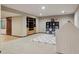 Spacious finished basement with open layout, built-in shelving, and room for recreation or entertainment at 6213 S Lima Way, Englewood, CO 80111