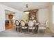Formal dining room featuring an elegant light fixture, seating for six, and a built-in china cabinet at 6213 S Lima Way, Englewood, CO 80111