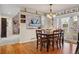 Cozy dining room featuring a brick accent wall and an adjacent living room at 6213 S Lima Way, Englewood, CO 80111