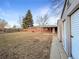 Large backyard with a covered patio and two storage sheds, perfect for outdoor entertaining and additional storage space at 1153 Sherman St, Longmont, CO 80501