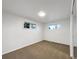 This bedroom has a carpeted floor, white walls, and two windows at 1153 Sherman St, Longmont, CO 80501