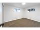 This bedroom has carpet, white walls, and two windows at 1153 Sherman St, Longmont, CO 80501