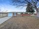 Charming red brick home featuring a well-maintained lawn and attached one car garage, perfect for a starter home or investment at 1153 Sherman St, Longmont, CO 80501