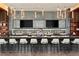 Stylish bar area with granite counters, modern lighting, and televisions for entertainment at 1133 14Th St # 4150, Denver, CO 80202