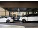 Upscale building entrance featuring luxury vehicles and prominent signage for a prestigious address at 1133 14Th St # 4150, Denver, CO 80202