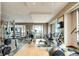 Well-equipped gym featuring modern machines, weights, large mirrors, and expansive windows with scenic views at 1133 14Th St # 4150, Denver, CO 80202