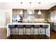Modern kitchen featuring a large island with seating, stainless steel appliances, and stylish cabinetry at 1133 14Th St # 4150, Denver, CO 80202