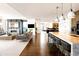 Open-concept living area with a sleek kitchen, fireplace, and expansive windows offering beautiful city views at 1133 14Th St # 4150, Denver, CO 80202