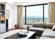 Elegant living room features built-in shelving and floor-to-ceiling windows with panoramic views at 1133 14Th St # 4150, Denver, CO 80202