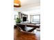 A sophisticated living room featuring a pool table, a media center, and large windows with city views at 1133 14Th St # 4150, Denver, CO 80202