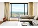Cozy living room with floor-to-ceiling windows offering breathtaking city views and ample natural light at 1133 14Th St # 4150, Denver, CO 80202