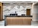 Stylish lobby with a staffed reception desk, statement lighting, and elegant decor for a grand entrance at 1133 14Th St # 4150, Denver, CO 80202