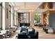 Comfortable resident lounge area with inviting seating, a bar, and natural light at 1133 14Th St # 4150, Denver, CO 80202