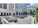 Upscale rooftop pool deck featuring lounge chairs, city views, and space for relaxation at 1133 14Th St # 4150, Denver, CO 80202