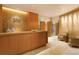 Inviting spa reception area features elegant wood accents, soft lighting, and a serene seating area at 1133 14Th St # 4150, Denver, CO 80202