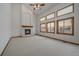 Spacious living room featuring a fireplace, high ceilings, and bright windows at 8181 S Saint Paul Way, Centennial, CO 80122