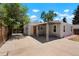 Quaint home featuring a grey exterior and a spacious concrete patio to enjoy outdoor living at 1023 Hooker St, Denver, CO 80204