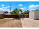 Large backyard featuring a concrete patio, shed and fencing for privacy and functionality at 1023 Hooker St, Denver, CO 80204