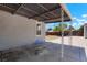 Cozy covered patio featuring white metal pillars, grey siding and offering shade for outdoor entertaining at 1023 Hooker St, Denver, CO 80204