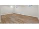 Spacious basement living area with neutral wood flooring, bright white walls and abundant natural light at 1023 Hooker St, Denver, CO 80204