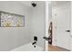 Modern bathroom showcasing stylish tile work, a bathtub, and contemporary fixtures at 1023 Hooker St, Denver, CO 80204