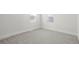 Bright bedroom featuring plush gray carpet, light walls, white trim and ample natural light at 1023 Hooker St, Denver, CO 80204