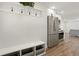 Functional entryway with storage bench, hooks, and easy access to the kitchen at 1023 Hooker St, Denver, CO 80204