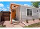 Charming home entrance with an orange door, stylish accents, and a well-maintained exterior at 1023 Hooker St, Denver, CO 80204