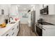 Bright kitchen featuring sleek cabinetry, stainless steel appliances, and a modern aesthetic at 1023 Hooker St, Denver, CO 80204