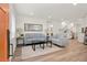 Inviting living room featuring modern decor, light wood floors, and an open layout to the kitchen at 1023 Hooker St, Denver, CO 80204