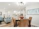 Bright open-concept living and dining area with modern lighting and stylish decor at 1023 Hooker St, Denver, CO 80204