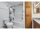 Well-lit bathroom with built-in storage and neutral finishes at 11676 Josephine Cir, Thornton, CO 80233