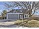 Charming gray two-story home with a well-maintained lawn and mature trees at 11676 Josephine Cir, Thornton, CO 80233