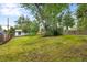 Lush backyard featuring mature trees and a well-maintained lawn at 5573 S Huron St, Littleton, CO 80120