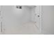 Clean basement space with white marble tile flooring and crisp white walls at 5573 S Huron St, Littleton, CO 80120