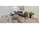 Cozy basement living room features stylish decor, ample seating, and modern accents at 5573 S Huron St, Littleton, CO 80120
