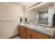 Elegant bathroom with double vanity and a walk-in shower at 6631 E Ithaca Pl, Denver, CO 80237